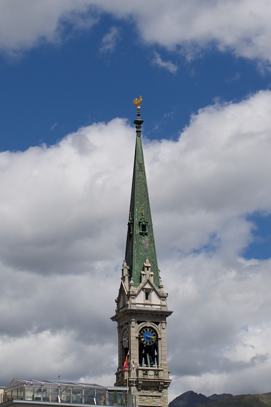 The restored golden cockerel being returned to the church tower in St Moritz
