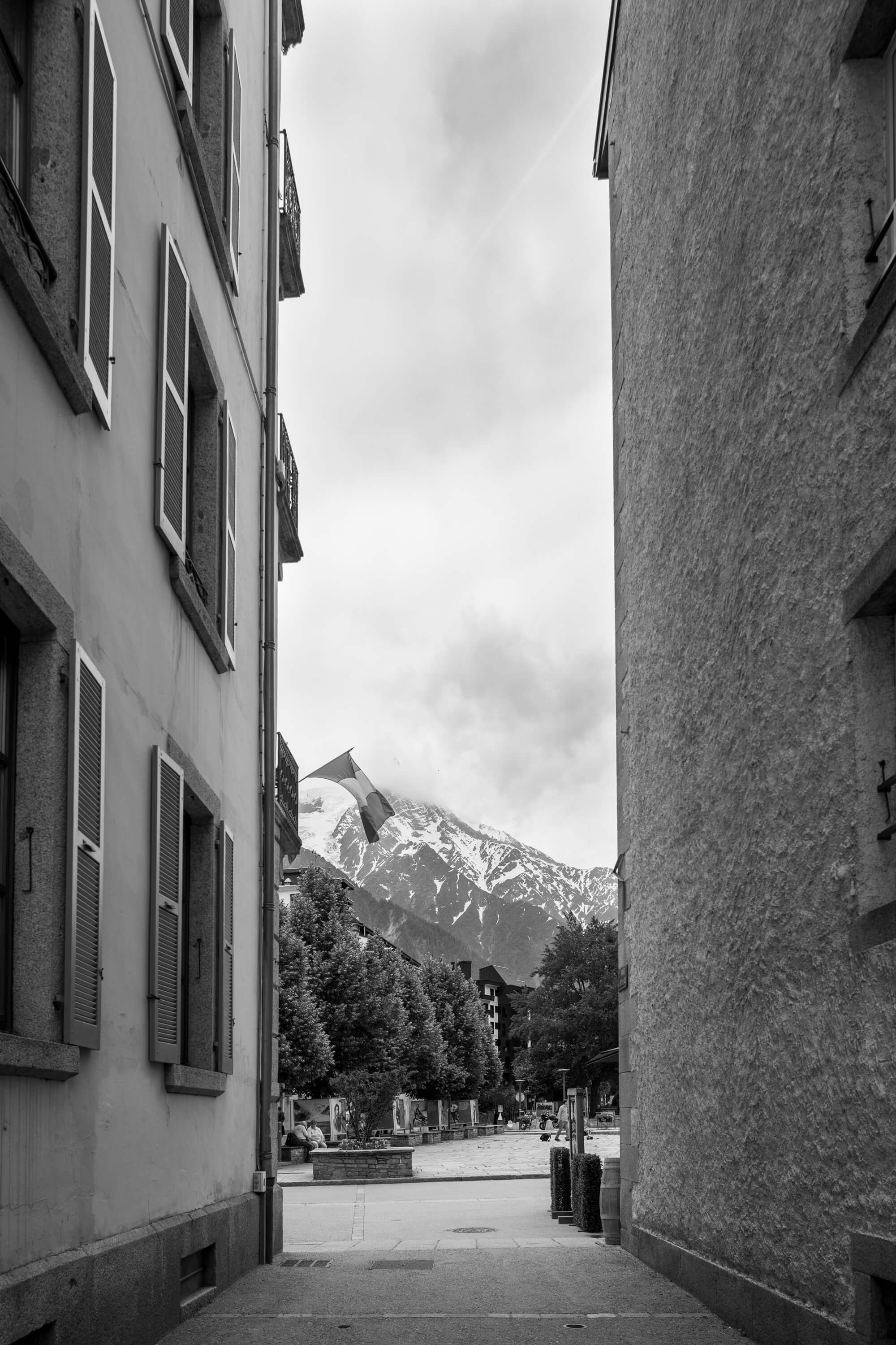 The mountains appear between two building