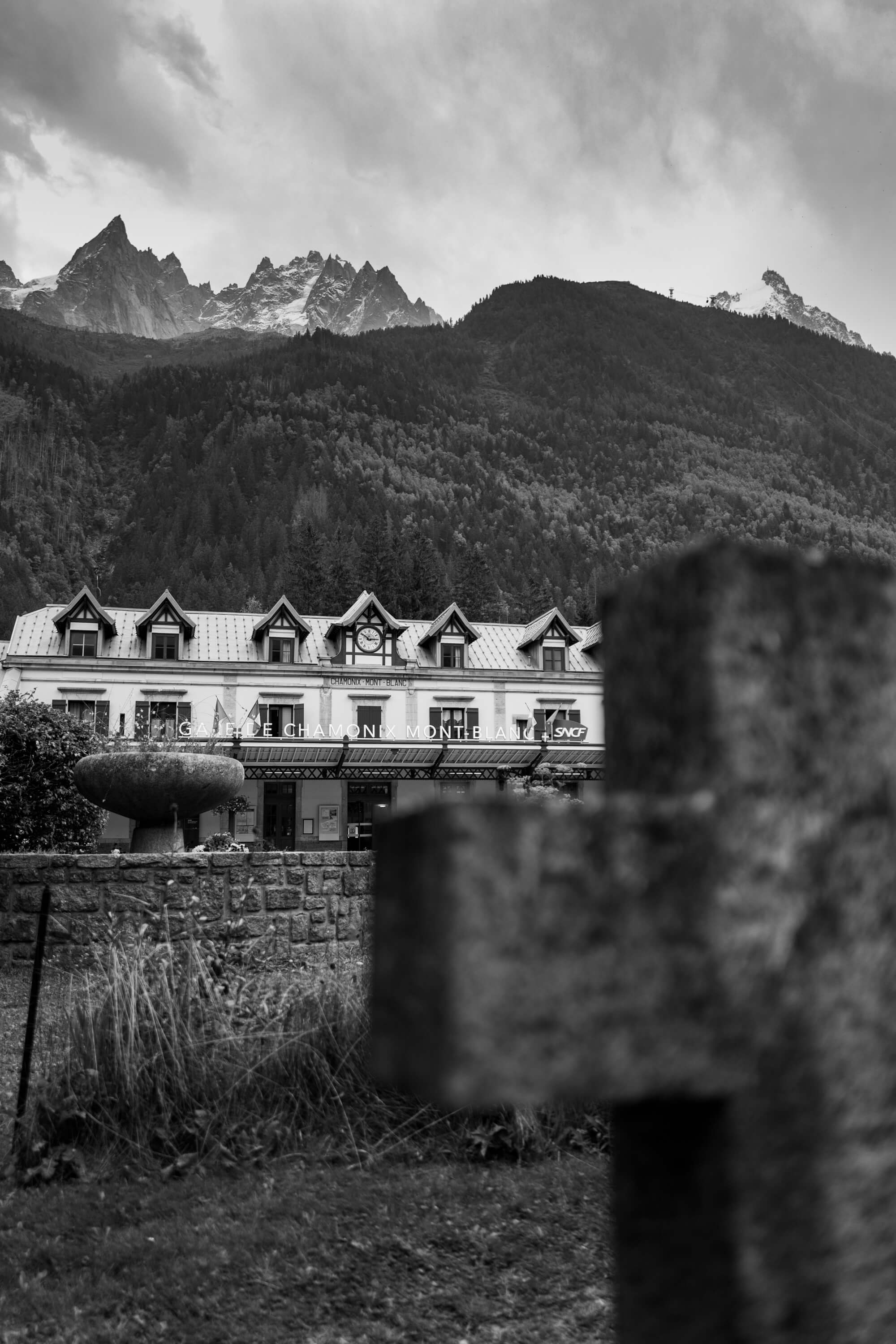 The aiguilles sit in the distance behind the train station and cemetary