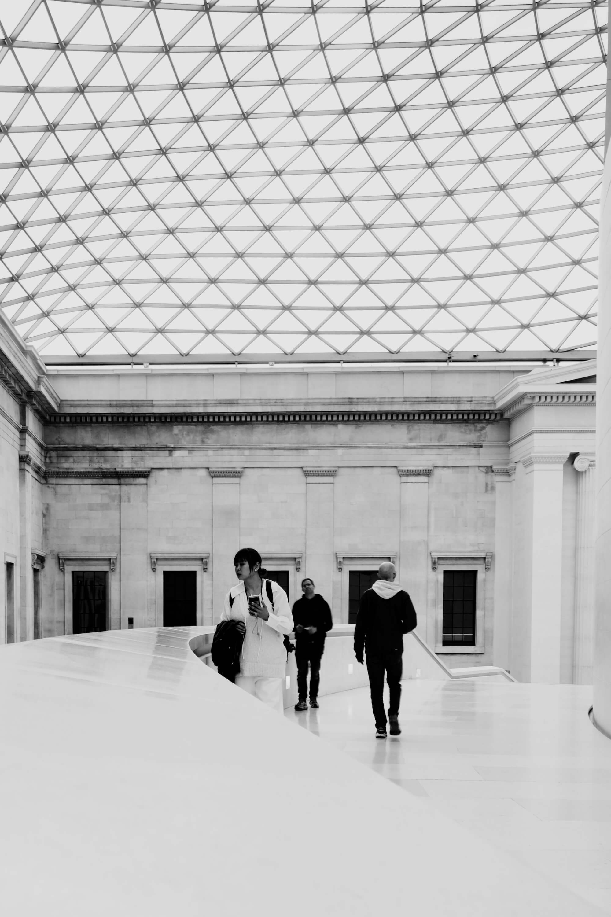 People moving through the central staircase