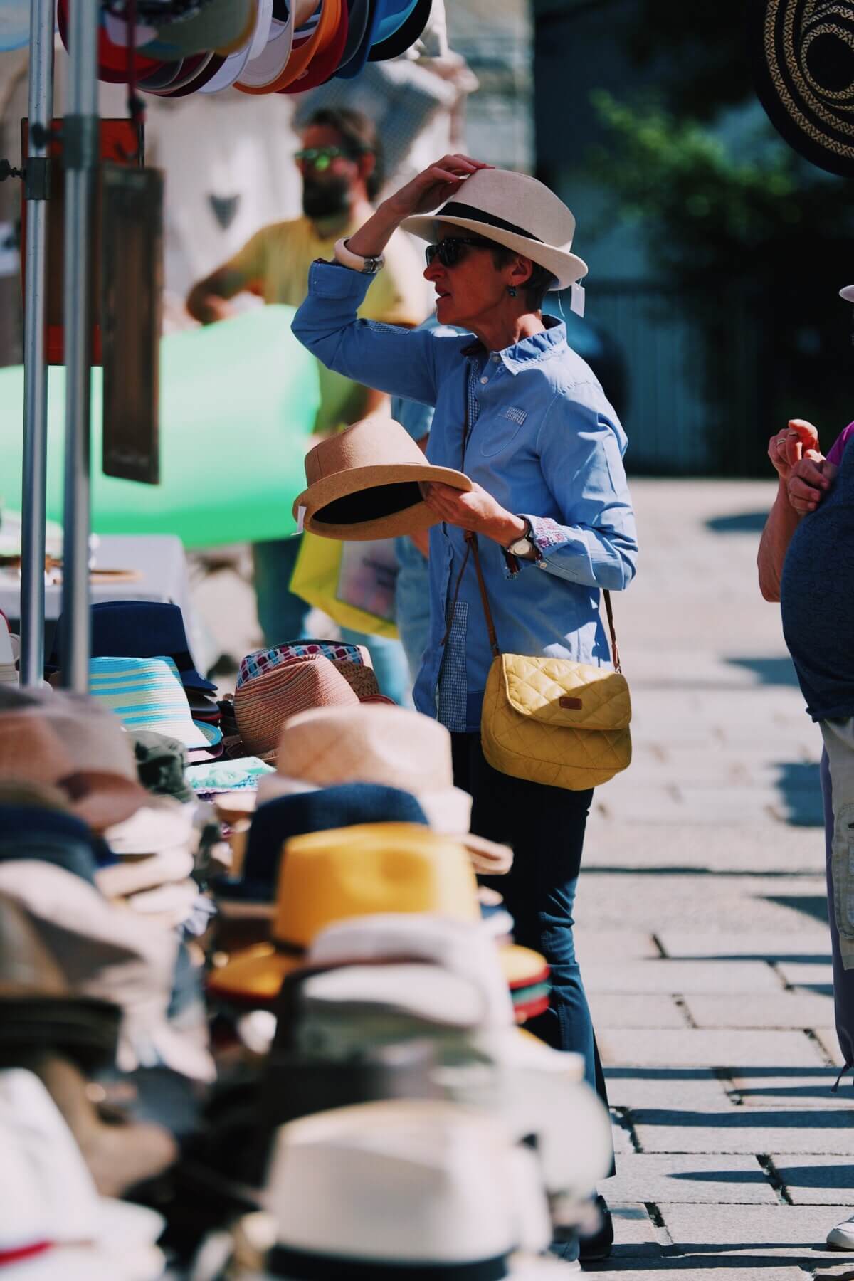 Trying on a hat in Chamonix Market