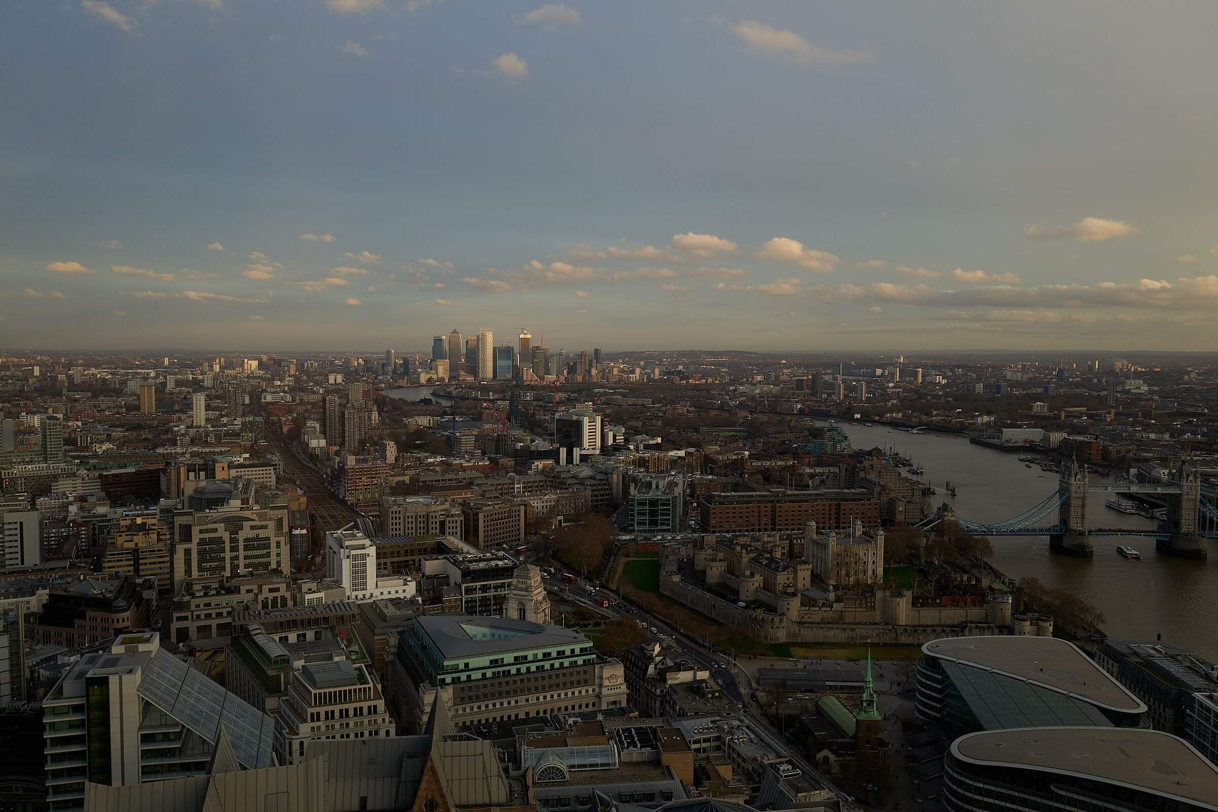 Tower Bridge and the Tower of London with Canary Wharf in the distance