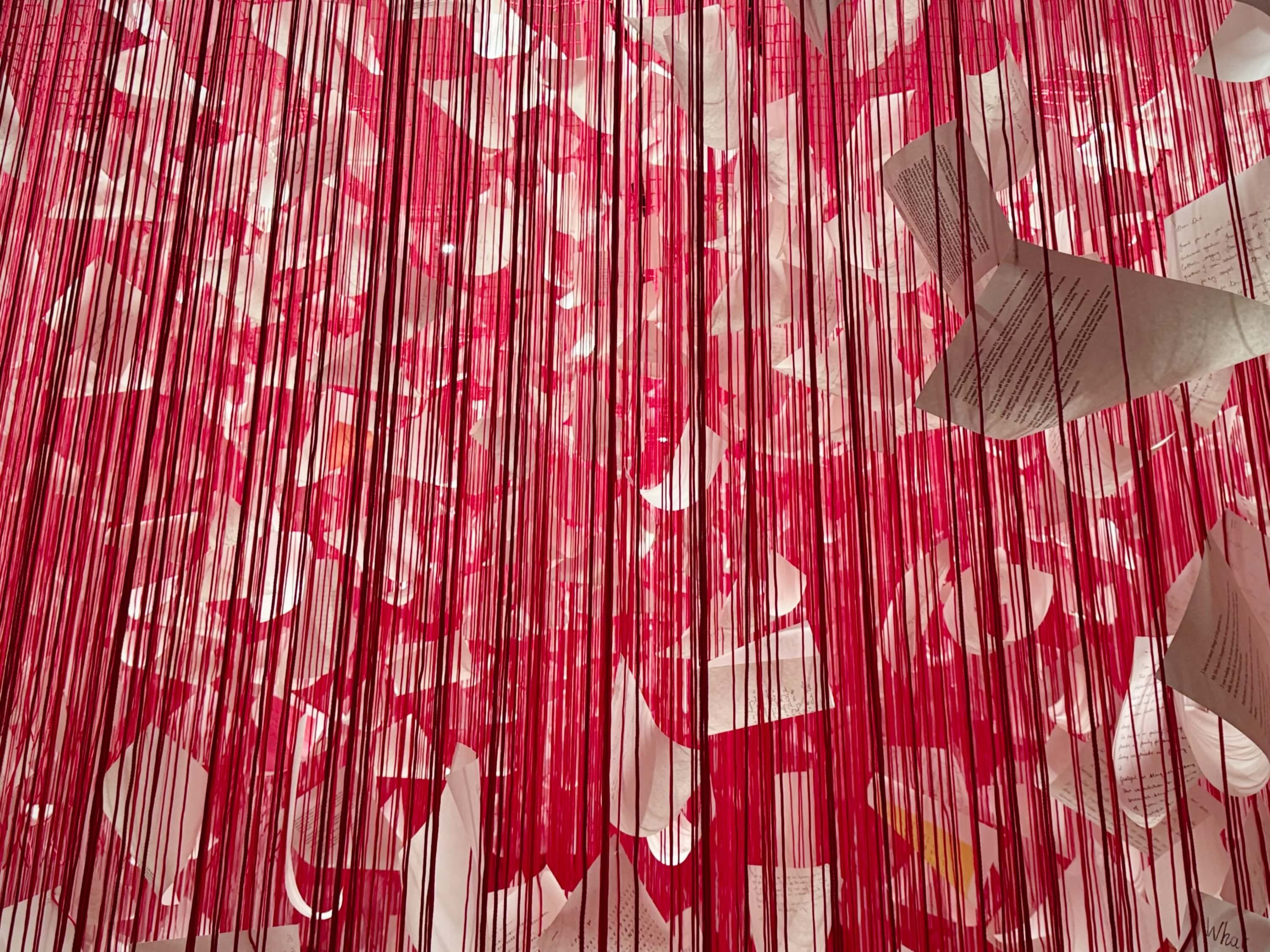 A wide shot of letters in the threads exhibition
