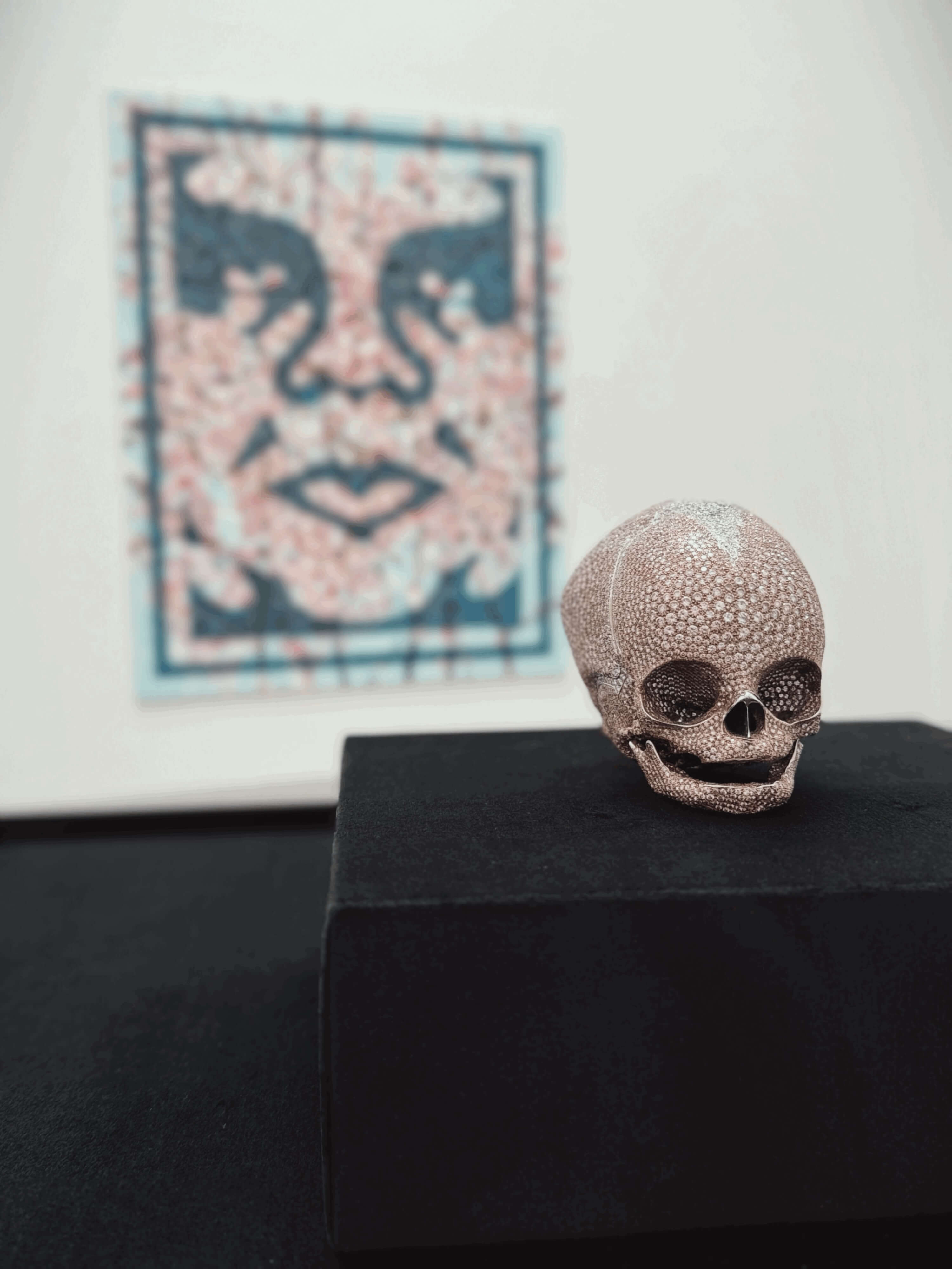 Diamond-covered skull artwork displayed within the exhibition